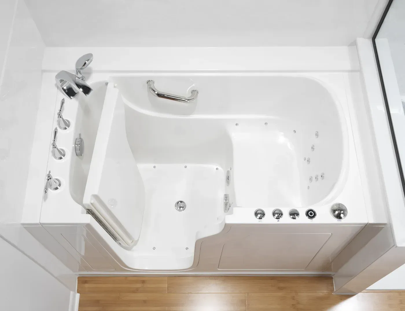 White walk-in jetted tub with built-in seat, grab bars, chrome fixtures, and therapeutic water jets.
