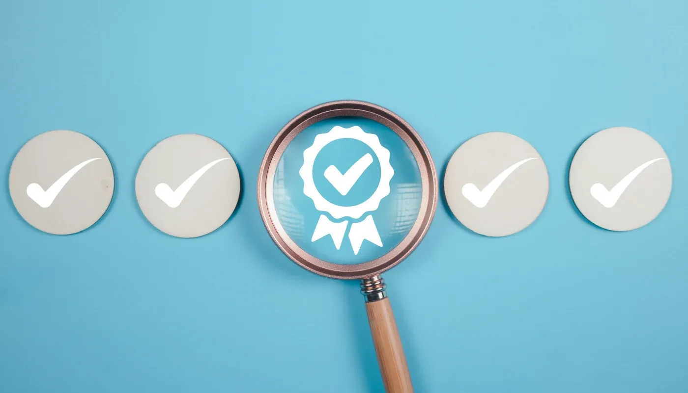 Magnifying glass highlighting a badge with checkmark and ribbon, surrounded by four circular buttons with checkmarks, representing quality assurance and certification selection