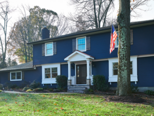 Two-story home with blue vinyl siding