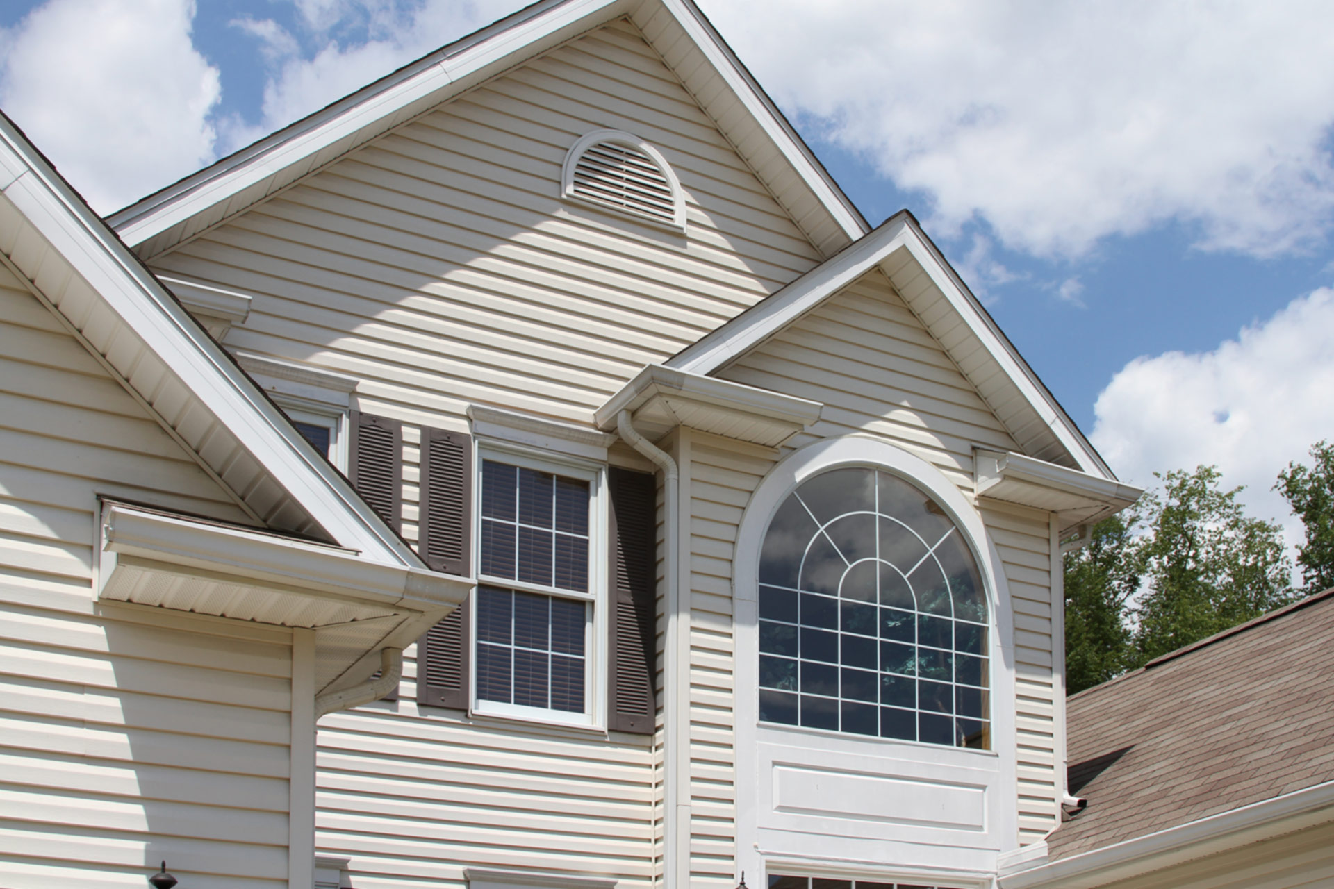 A classically charming 2-story home features brand new siding.