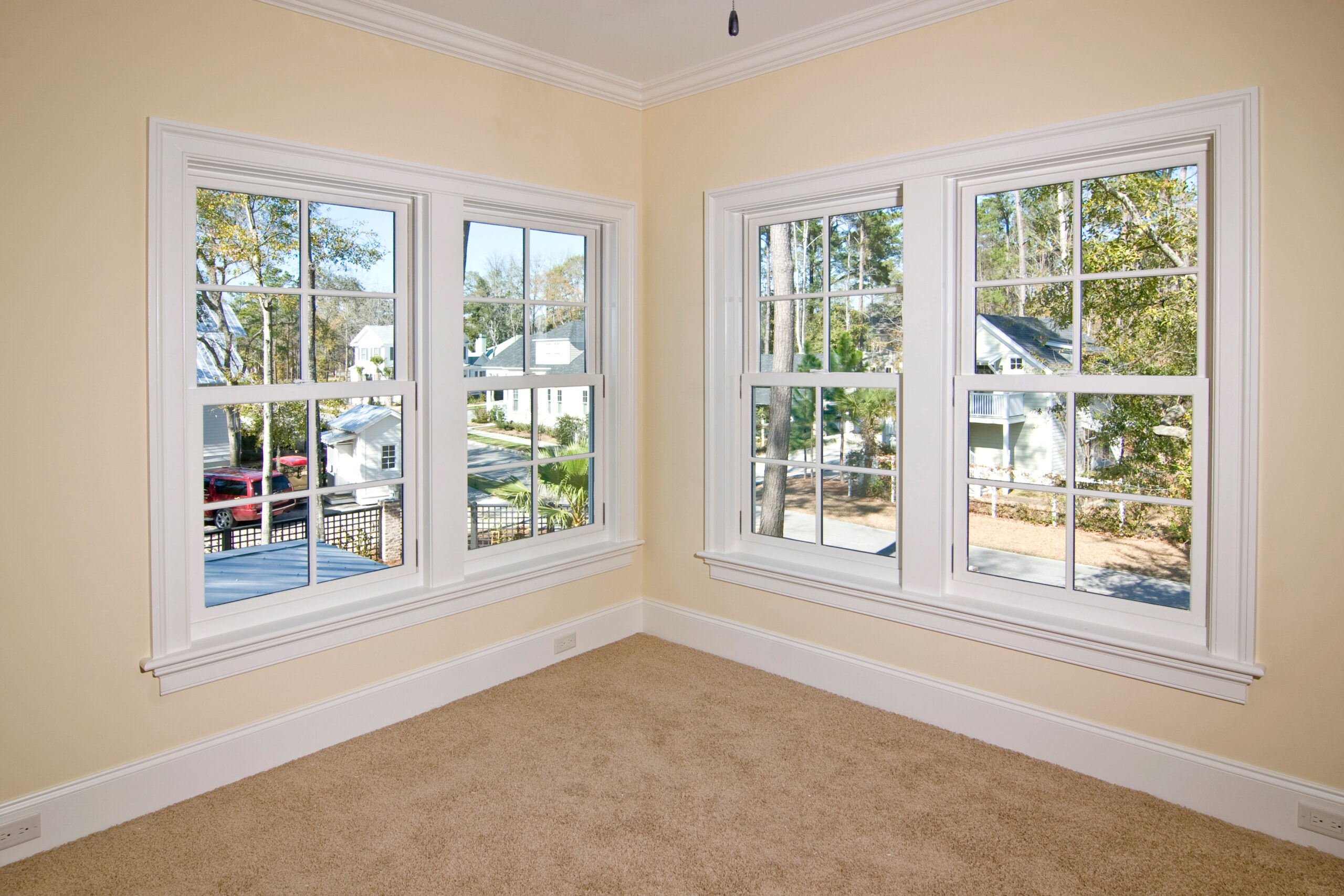 Double-hung windows in bright, empty room