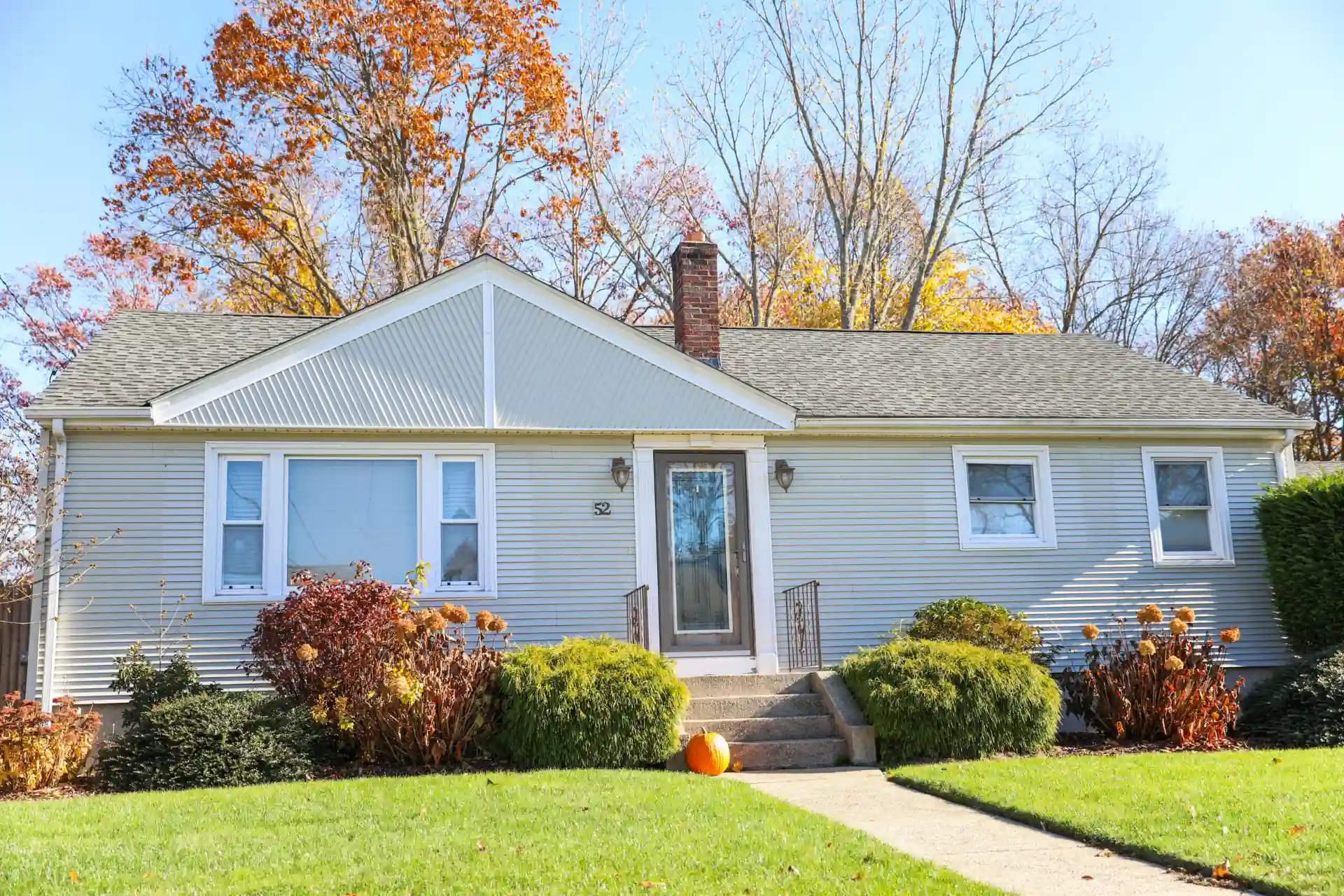 Gray bungalow with asphalt roof installation by Exterior Pros in Decker, WI